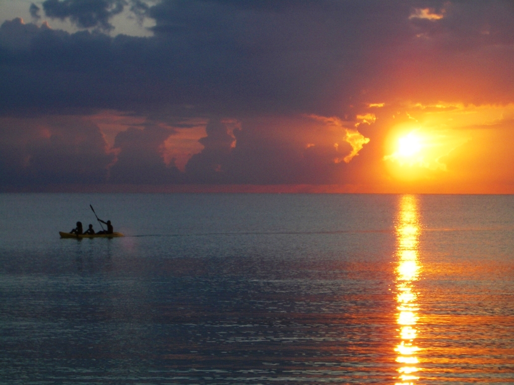 Seven Mile Beach in Negril lined with palm trees and calm turquoise water