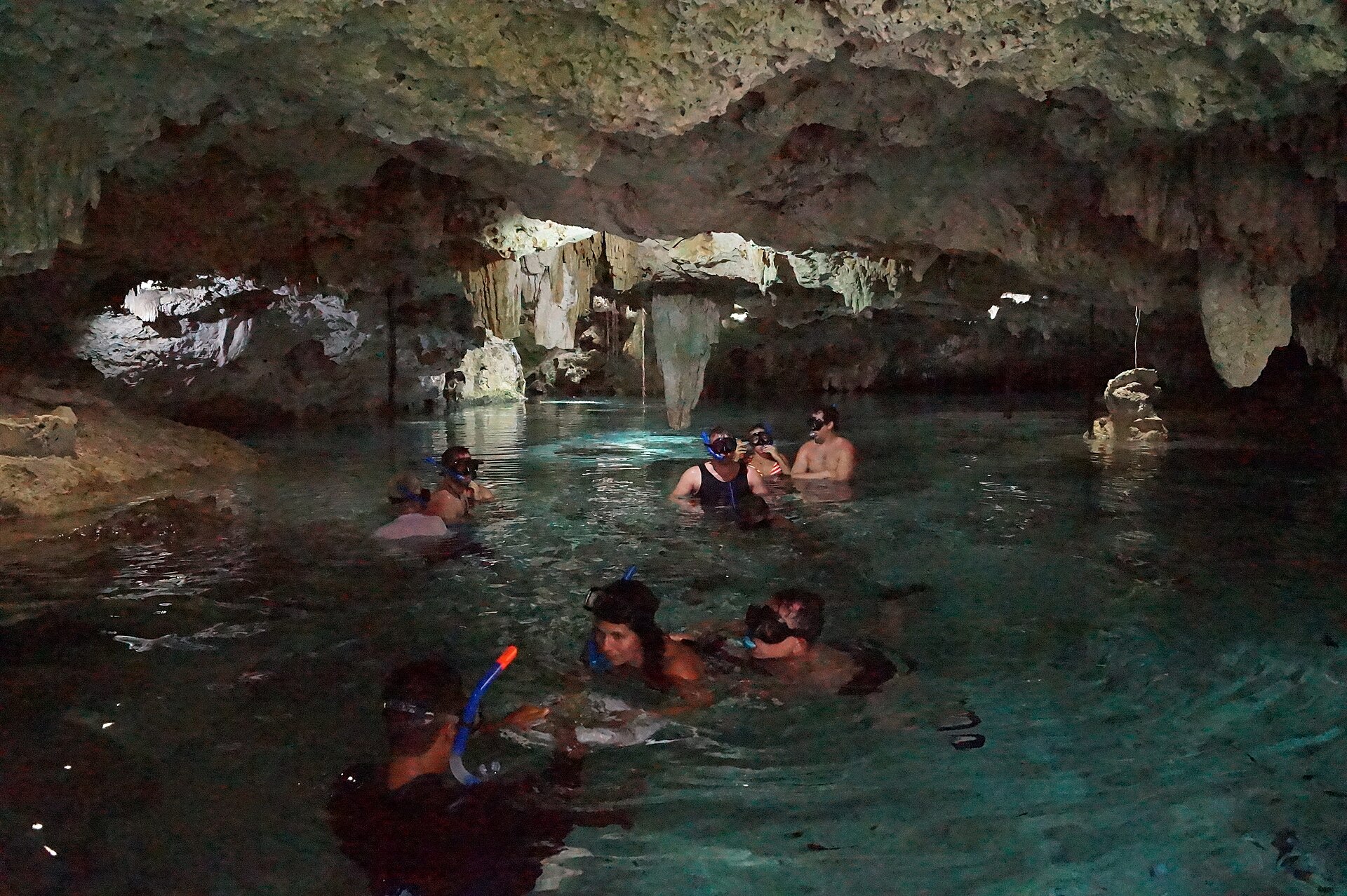 Clear turquoise water inside the Aktun Chen cenote cave system