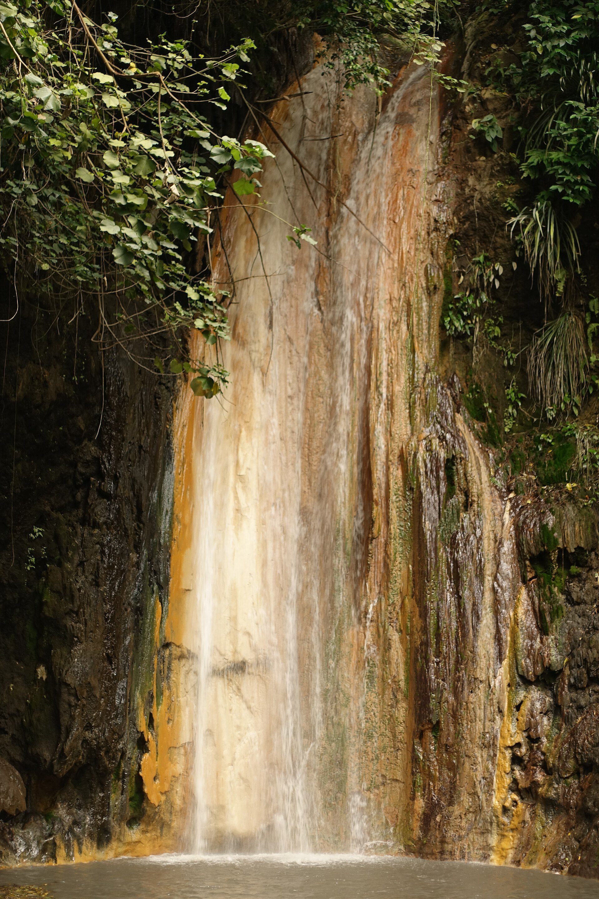Diamond Falls waterfall cascading over mineral-streaked rock near Soufrière