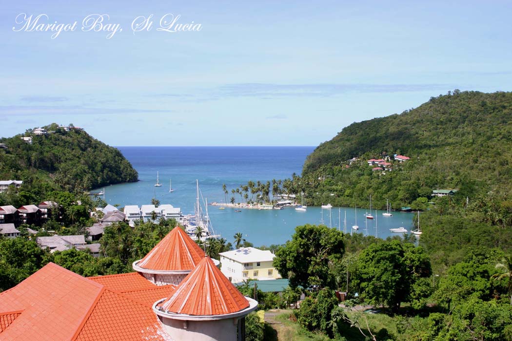 Yachts anchored in the palm-fringed, hurricane-protected harbor of Marigot Bay